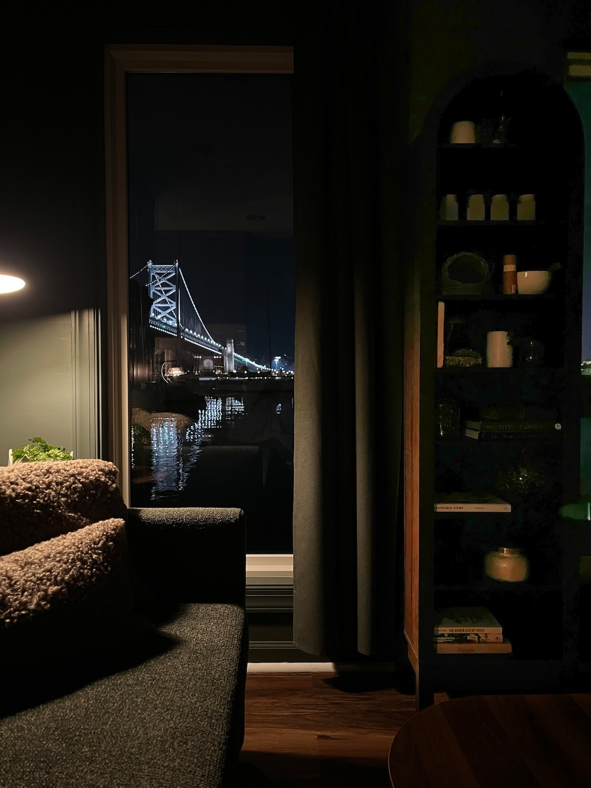 The Benjamin Franklin Bridge glowing beyond The Sylvan's living room window