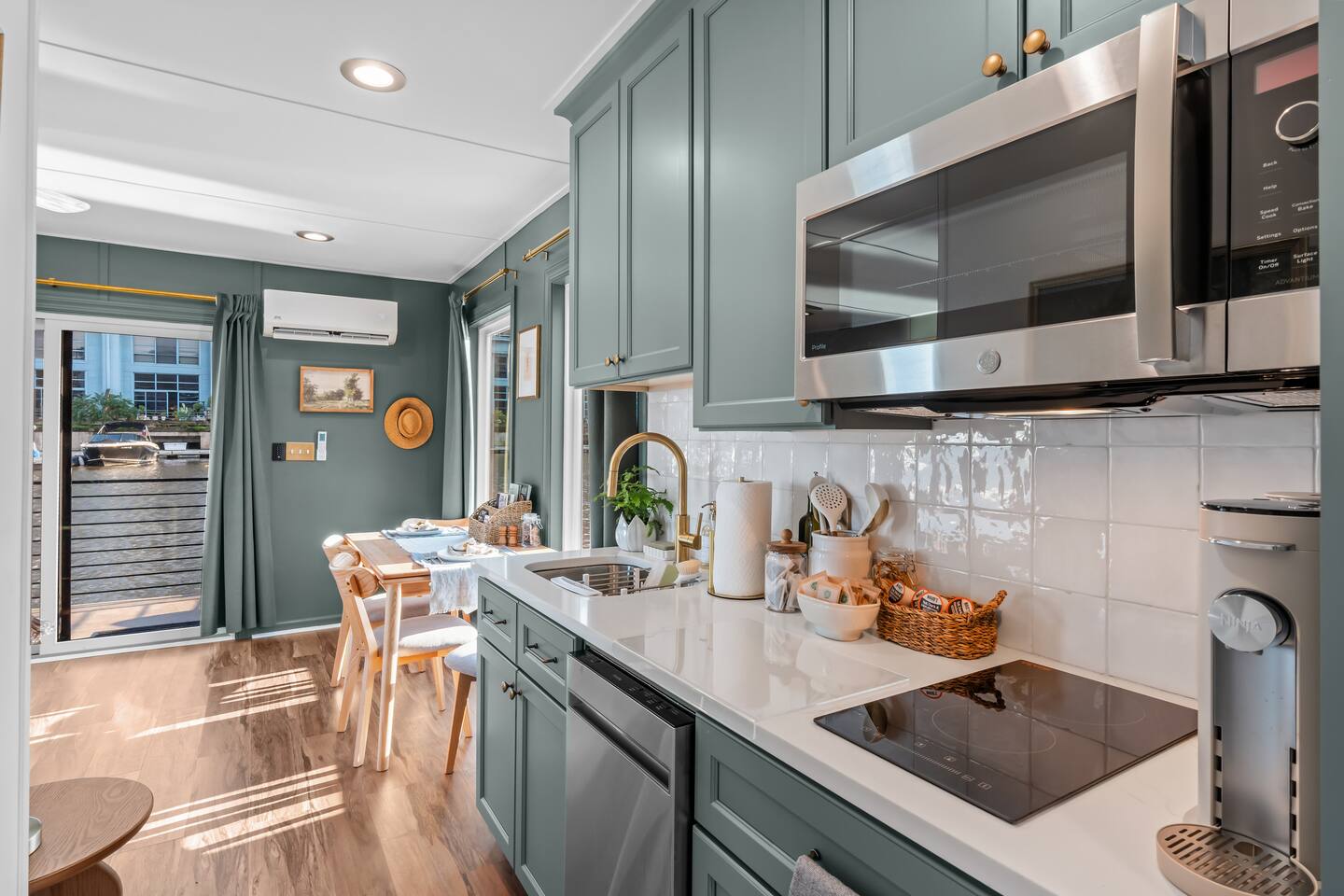 Kitchen with cooktop and microwave