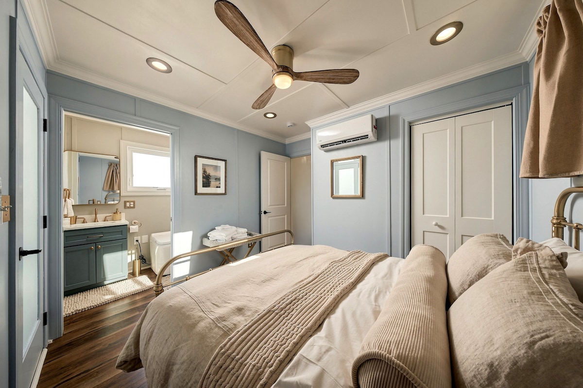 Bedroom wide view with ceiling fan