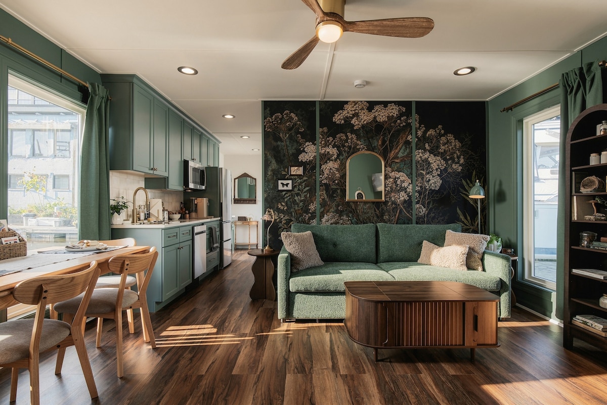 Kitchen and living room with botanical wallpaper